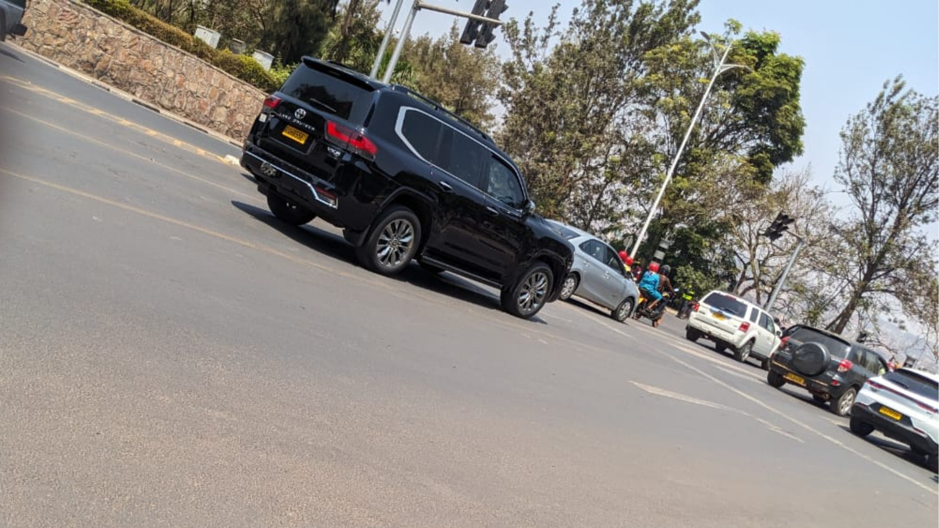 Professional driver with rental car in Rwanda